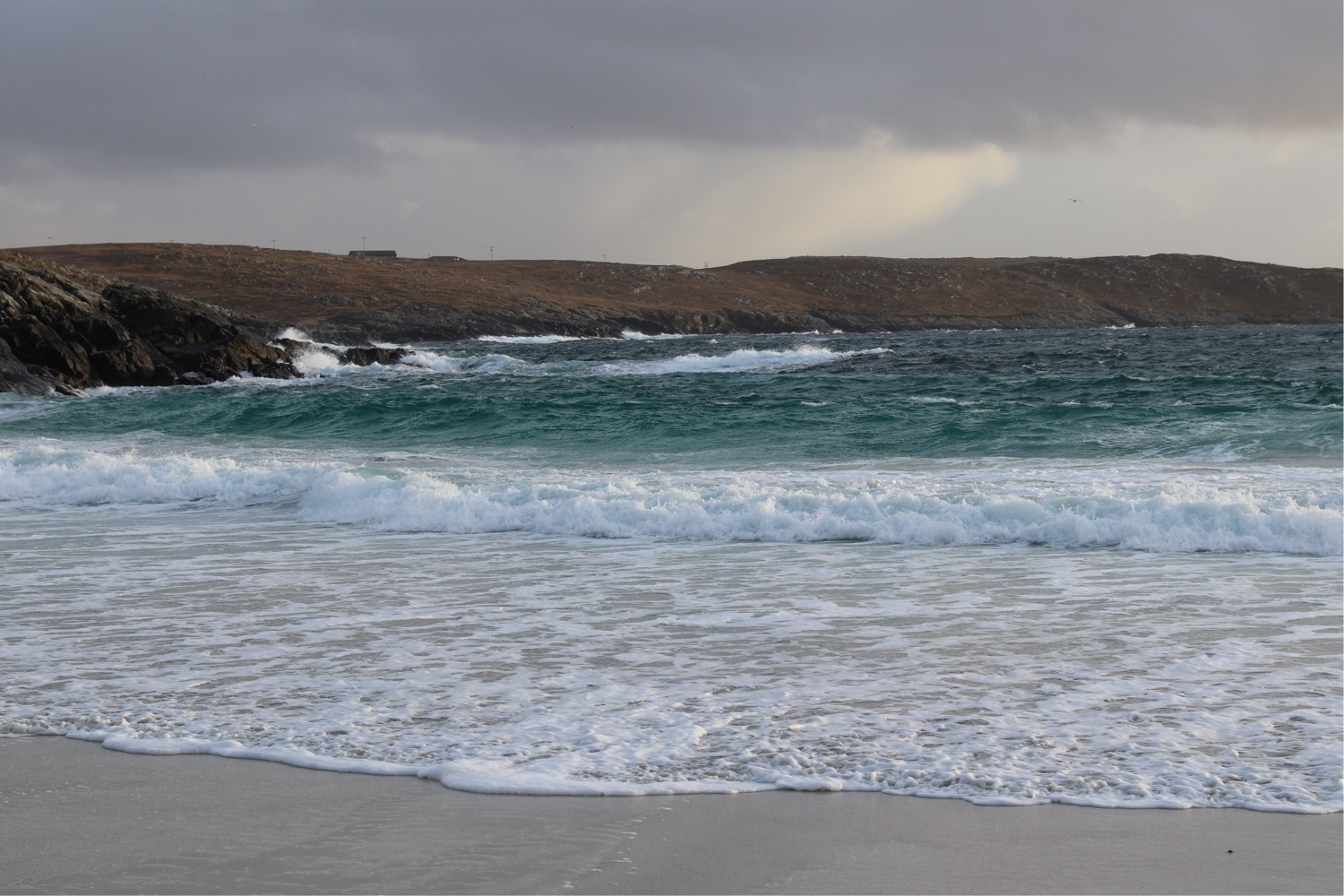 image of waves crashing on the shore in Hamnavoe which is one of the best coastal walks in Shetland.