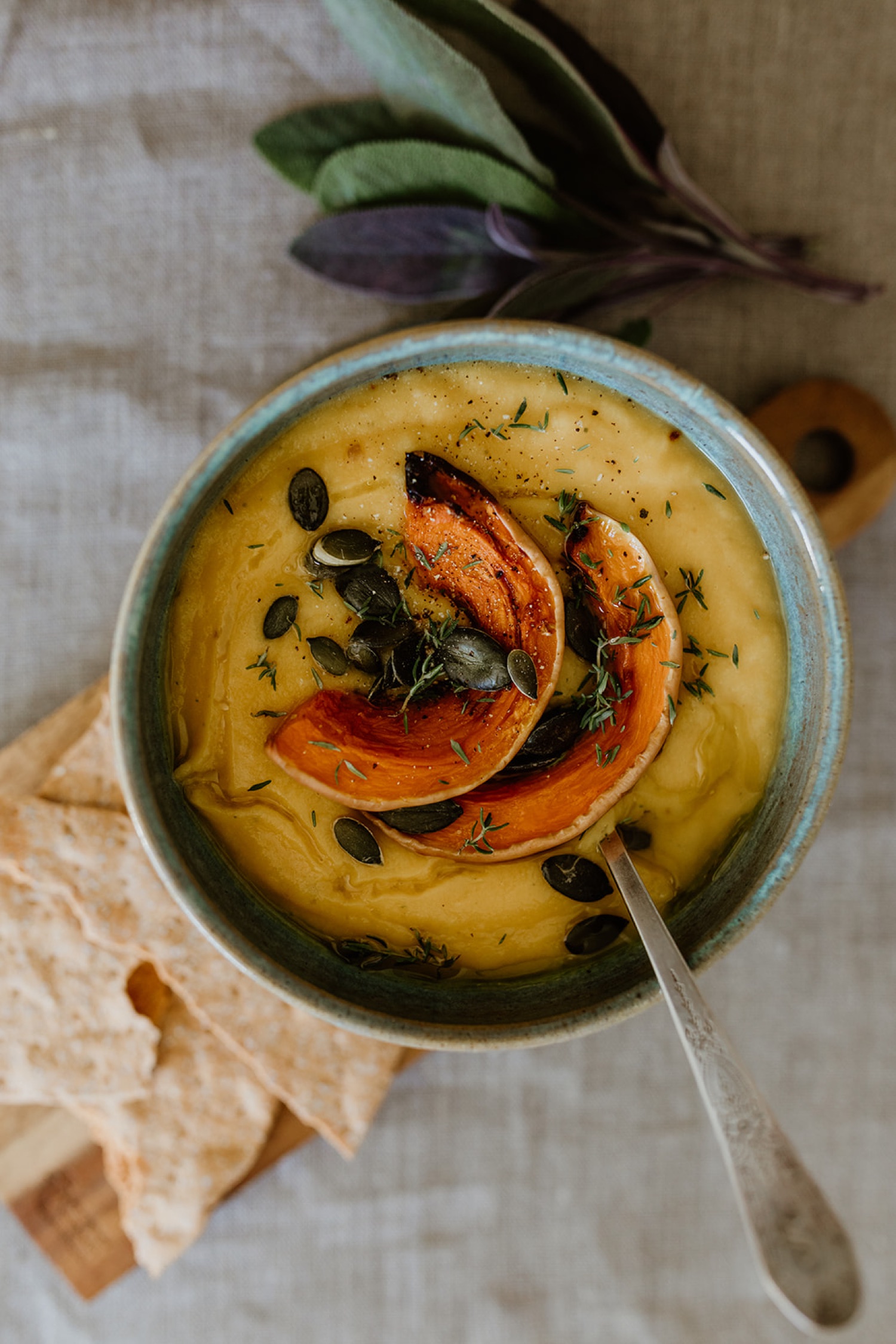 A ceramic bowl filled with delicious autumn pumpkin soup made from a favourite recipe