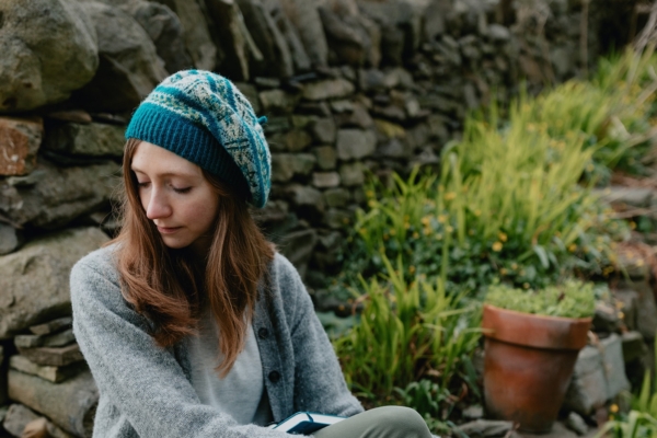 Woman wearing a Noness Beret which was made using a Fair Isle Knitting Patterns